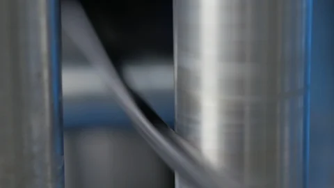 Plant for the production of the cable. Covering the copper cable with a sheath. Stock Footage 125380405