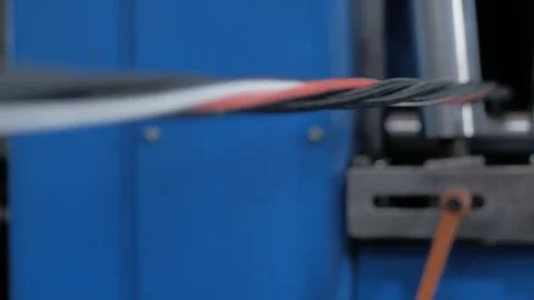 Plant for the production of the cable. Covering the copper cable with a sheath. Stock Footage 125690632