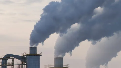 Plant stacks contributing to climate change pouring out smoke into atmosphere Video stock 149286118