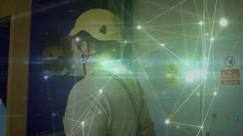 Plant tech inspecting blue cabinet seeing caution sign talking via window for 스톡 동영상 333965790