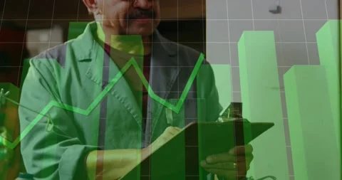 Plant tech writing on clipboard for check while data updating and green charts Stock Footage 331701267