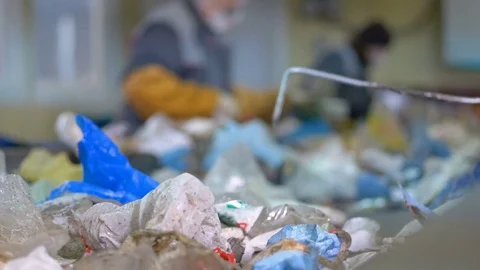 Plant workers sorting trash manually. Stock Footage 76355408