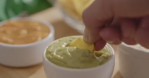 Plantain Chips Dipping into Sauce - Appetizing Snack Video Stock Footage 264791912