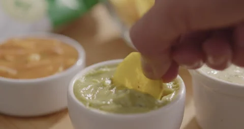 Plantain Chips Dipping into Sauce - Appetizing Snack Video Stock Footage 264791927