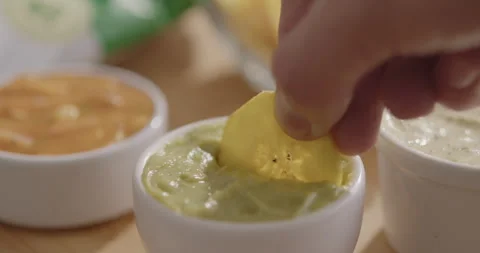 Plantain Chips Dipping into Sauce - Appetizing Snack Video Stock Footage 264791976