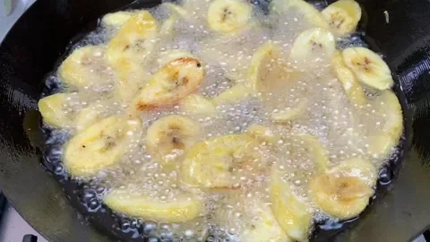 Plantain frying Stock Footage 135040409