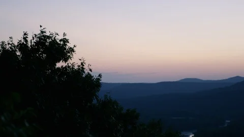 Plants Sit Beneath A Sunrise On The Edge Of A Green Valley Stock Footage 87397491