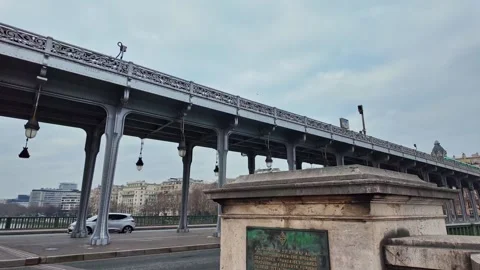 Plaque in memory of battle of Bir Hakeim and train passing over bridge, Paris Stock Footage 305488855