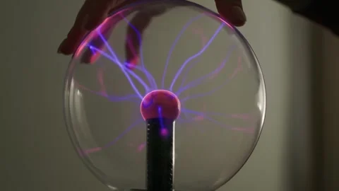 Plasma ball. Hands holding plasma light ball. Plasma ball light ray science Stock Footage 261885682