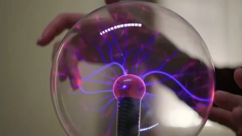 Plasma ball. Hands holding plasma light ball. Plasma ball light ray science Stock Footage 261885945