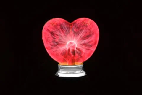 Plasma ball heart glowing in the dark Stock Photos