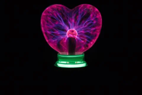 Plasma ball heart glowing in the dark Stock Photos