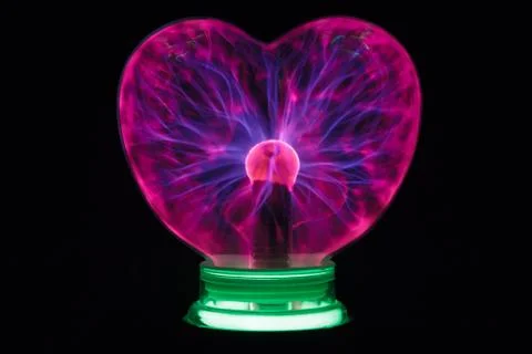 Plasma ball heart glowing in the dark Stock Photos