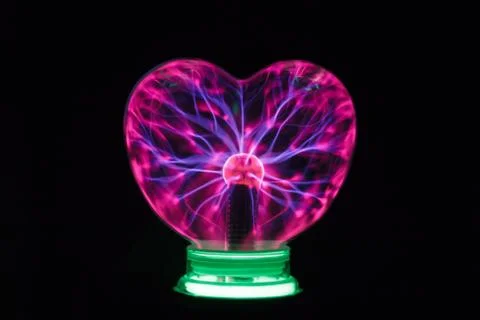 Plasma ball heart glowing in the dark Stock Photos