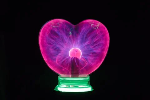 Plasma ball heart glowing in the dark Stock Photos