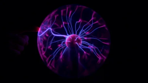 Plasma ball with high voltage lightning attracted to finger Stock-Footage 140873832