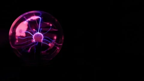 A Plasma Ball Set to the Left With a Hand Touching the Backside of the Glas.. Video stock 304472092