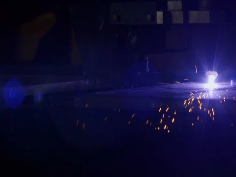 Plasma cutter cutting through metal in slow motion Stock Footage 75406231