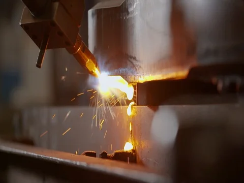 Plasma cutter cutting through metal with dripping metal Stock Footage 80862896