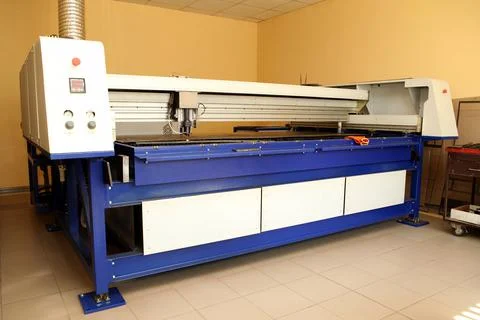 Plasma cutting CNC machine cuts metal material with sparks, industry backgrou Stock Photos