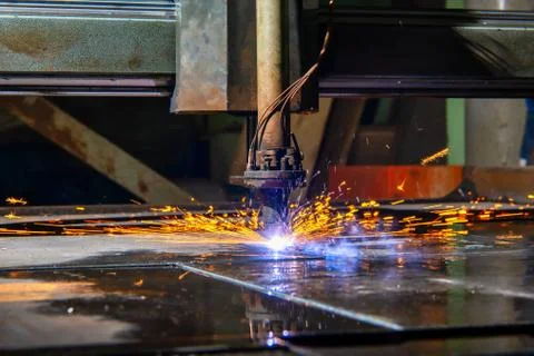 Plasma cutting machine cuts large and thick steel sheets. Stock Photos