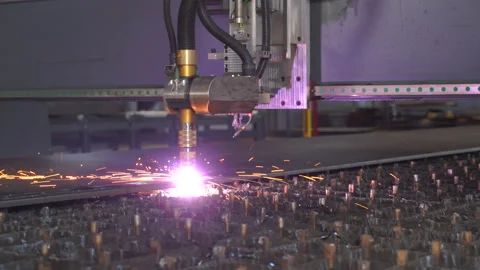 Plasma cutting machine cuts metal material with sparks Stock Footage 133421767