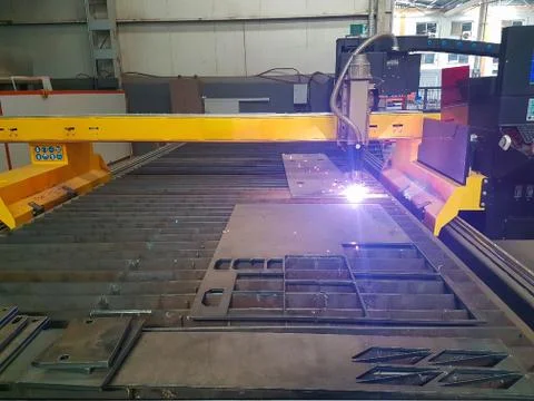 Plasma cutting machine working with bright light detail Фото