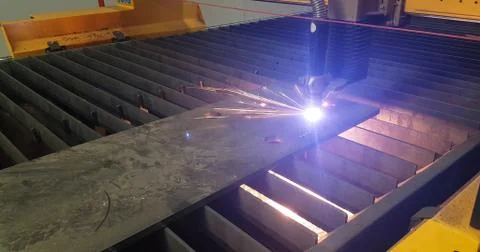 Plasma cutting machine working with bright light detail Stock Photos