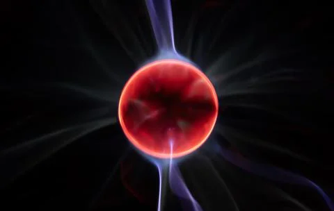 Plasma sphere with atom core. Electric arcs create motion. Atom core shines.. Stock Photos