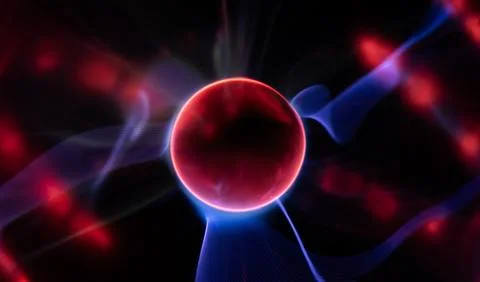 Plasma sphere reveals atom core. Electric arcs form light. Atom core glows br Stock Photos