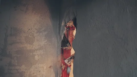 Plaster and broken bricks flying in all directions. A hole in the wall Stock Footage 240919903