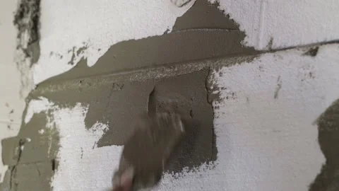 Plaster is applied to the foam, insulation of the facade of the house Vídeos de archivo 219116793