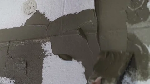 Plaster is applied to the foam, insulation of the facade of the house Vídeo Stock 219199641