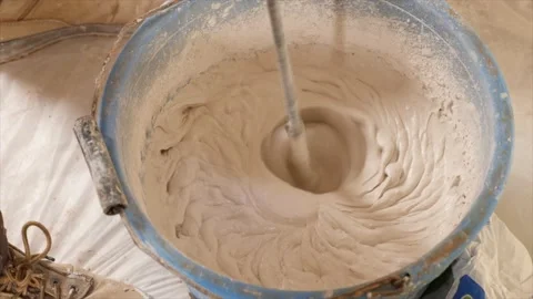 Plaster being mixed in a bucket Stock Footage 136257715