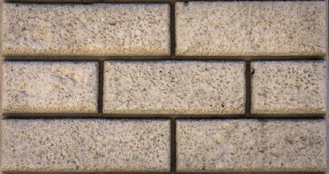 Plaster brick wall background, dark yellow color wall. Stock Photos