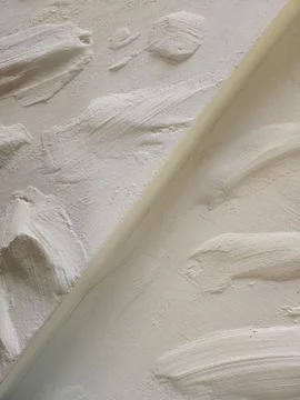 Plaster coating on the wall. Rough decorative plaster Stock Photos