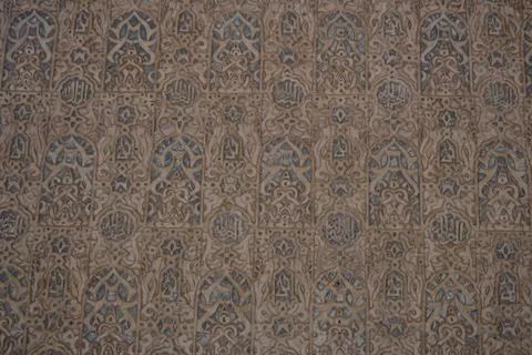 Plaster covers the surface in rows of arches. Patterns repeat from top to bot Stock Photos