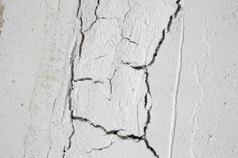 The plaster with cracked wall background Stock Photos