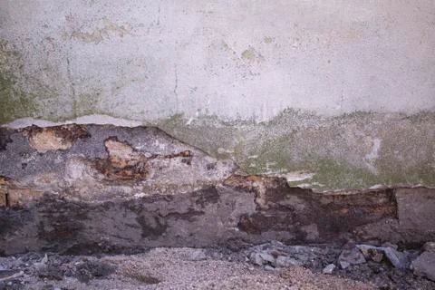 Plaster on facade crumbles due to moisture and mold Stock Photos