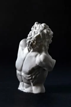Plaster figure in black background	 Foto stock