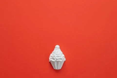 A plaster figure of a cake on a colored background Stock Photos