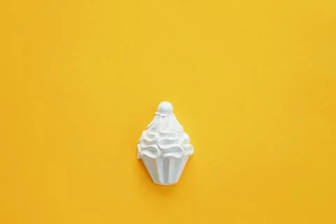 A plaster figure of a cake on a colored background Stock Photos