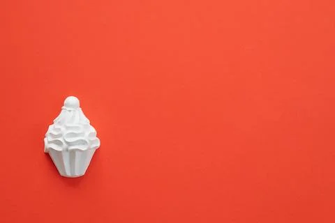 A plaster figure of a cake on a colored background Stock Photos