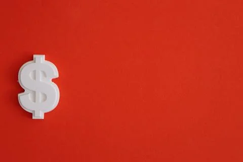 Plaster figure of dollar on a colored background Stock Photos