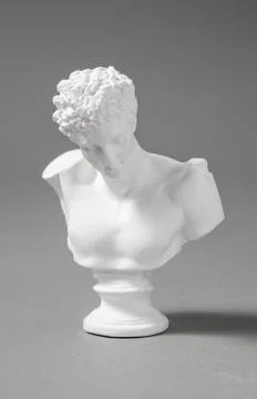 A plaster figure with a gray background Stock Photos