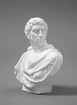 A plaster figure with a gray background Stock Photos