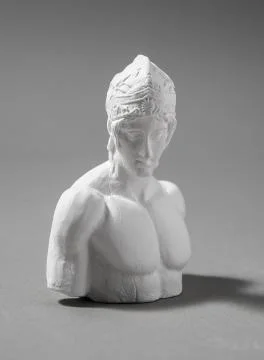 A plaster figure with a gray background Foto stock