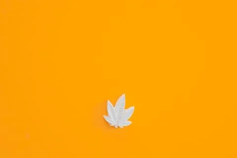 Plaster figure of hemp on a yellow background Stock Photos