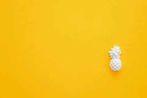 A plaster figure of a pineapple on a colored background Stock Photos