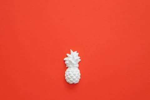 A plaster figure of a pineapple on a colored background Stock Photos